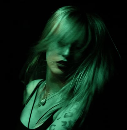 a woman with tattoos on her arm and a tattoo on her arm