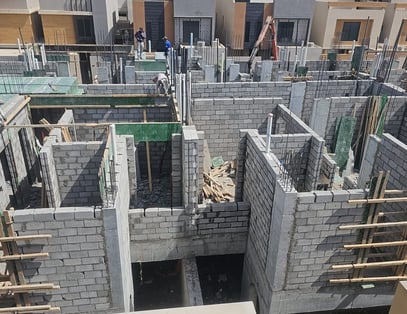 a building being built into a house with a concrete structure
