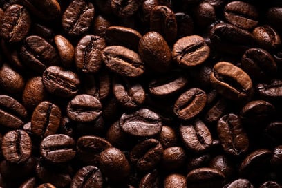 a close up of a pile of coffee beans