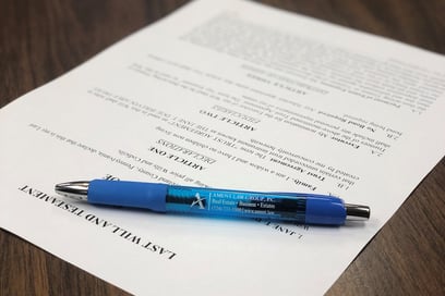 a pen with a paper on a table