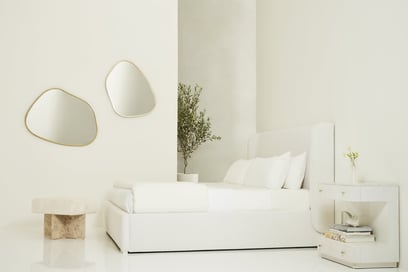 a bedroom with a bed set in the centre 