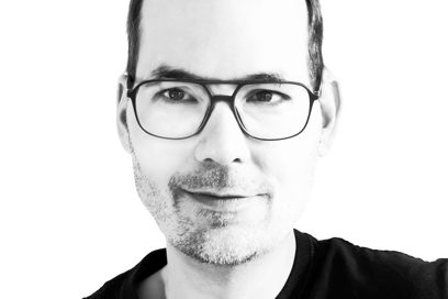 a man with glasses and a beard