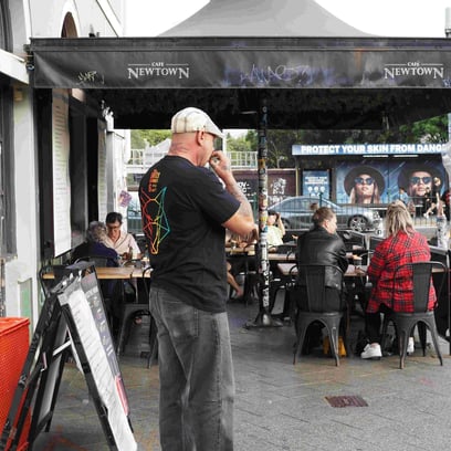 People outside coffee shop in Newtown.