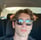 a man with sunglasses and sunglasses on his head