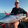 man and yellowfin tuna on boat in Zanzibar