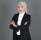 a woman in a suit and hijab