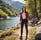 Woman posing on a sunny hiking path.