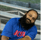 Man with blue shirt and beard smiling