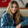 Perfil de una mujer que ha dejado una reseña, mostrando una sonrisa amigable.