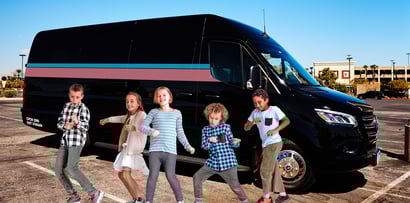 kids outside a party bus