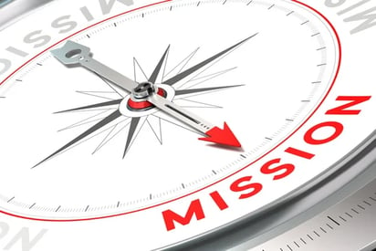 a compass with the word mission