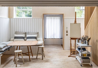 a living room with a couch and a table