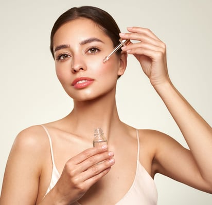 a woman with a white top using peptides