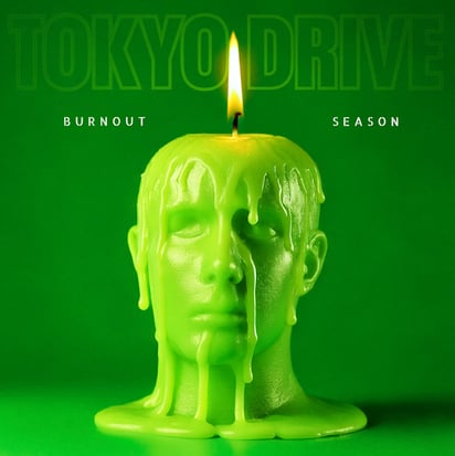 a candle with a candle in the middle of a green background