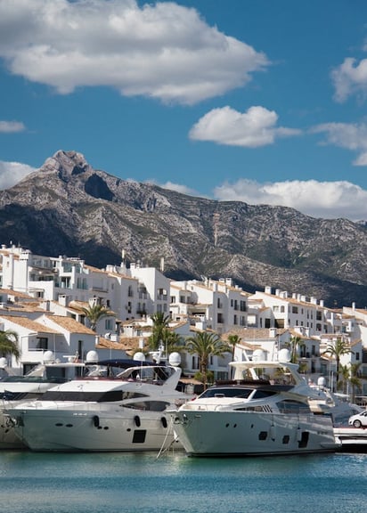View of Puerto Banus, the iconic marina in Marbella with La Concha mountain in the background