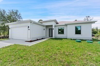 Beautifully designed front elevation of a new home for sale in Lehigh Acres, Florida.