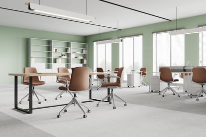 Office lounge with SenSit-Otto swivel chairs and bookshelf wall