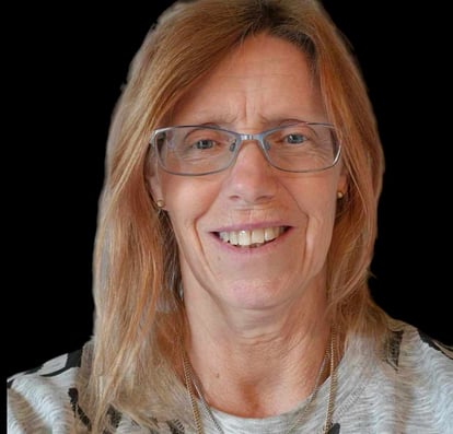 a woman with glasses and a necklace with a necklace