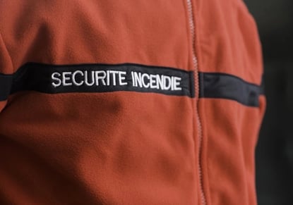 a security officer in uniform uniform with a security badge on the back of a man