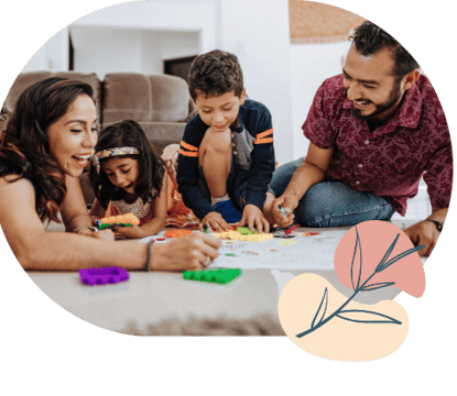 a family with young children playing with toys - happy