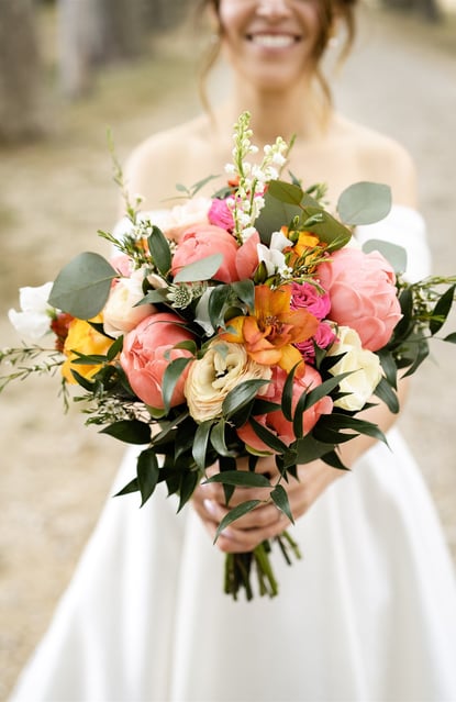 A bride showing is magnificient wedding flower bouquet