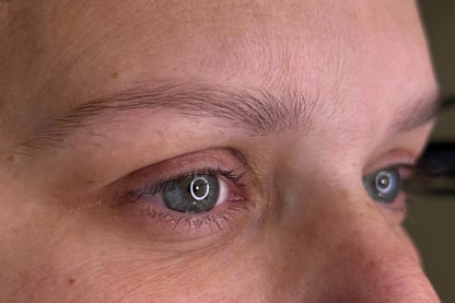 A woman with her current state of eyebrows before getting microblading procedure