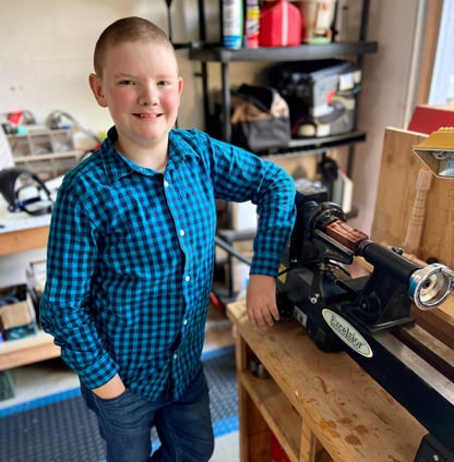 Jackson with his new lathe in his workshop