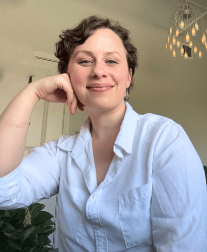 a woman in a white shirt and a black couch