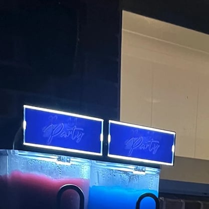 Talyssa's birthday with the slushie machine, glowing into the night in Alexandra Hills.