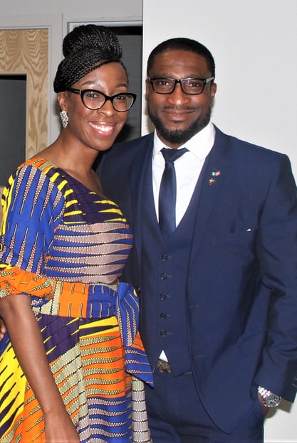 a man and woman standing next to each other