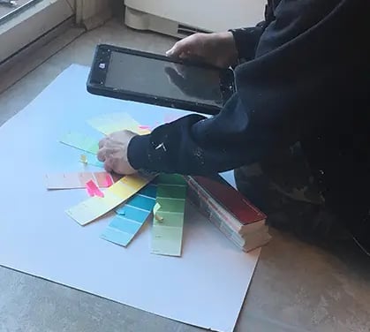 marcine selecting colors for a bespoke mural in nj