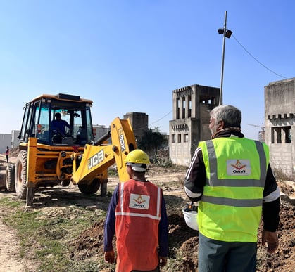 On-site trench excavation by Gavi Infra for civil EPC project – JCB machinery and field engineers in