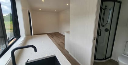 View of lounge from the kitchen in tiny home