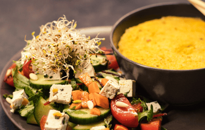 a bowl of vegan food with a bowl of soup