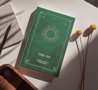 a family memoir book with a green cover and a flower