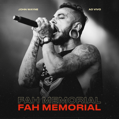 a man with tattoos on his chest and a microphone
