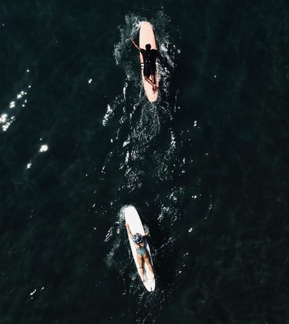 aerial drone view of surfers in batukaras
