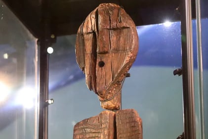a wooden carving of a wooden face close up fro the worlds oldest wooden sculpture