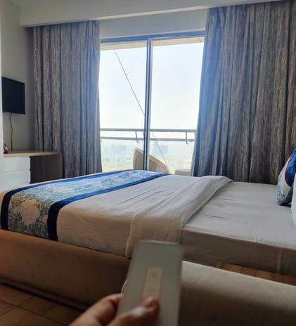 Image of a clean and comfortable bed inside a luxury apartment