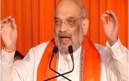 a man in a white shirt and orange scarf
