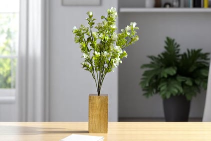 a vase with flowers in a vase on a table