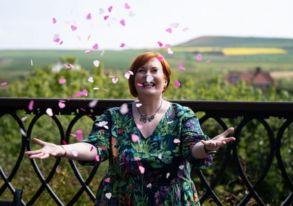 Celebrant throwing wedding confetti