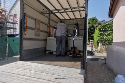 a man in a truck transporting a scanning electron microscope