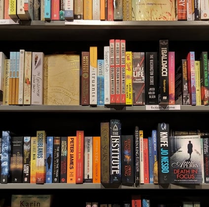 a book shelf with many books on it