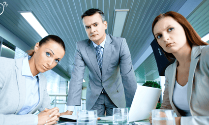 a group of business people looking with misunderstanding
