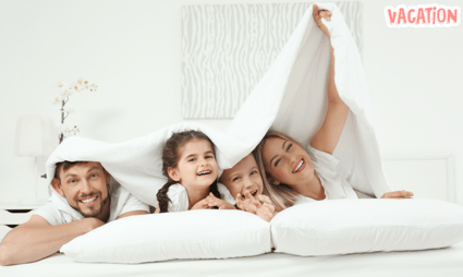 a family of four people are smiling and having fun