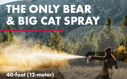 Woman using Frontiersman Bear Spray.
