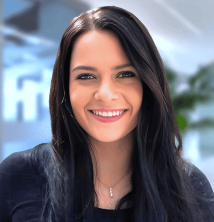 a woman with long hair and a black top