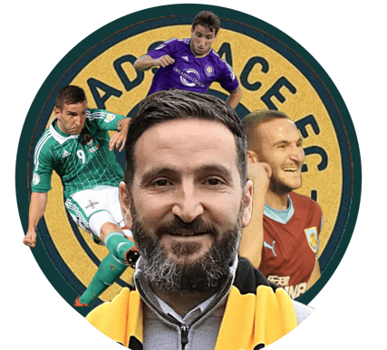 a man with a beard and a yellow jacket