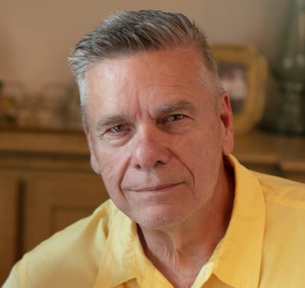 Spiritual biblical Metaphysical teacher Dr Roy e Richmond in a casual yellow shirt